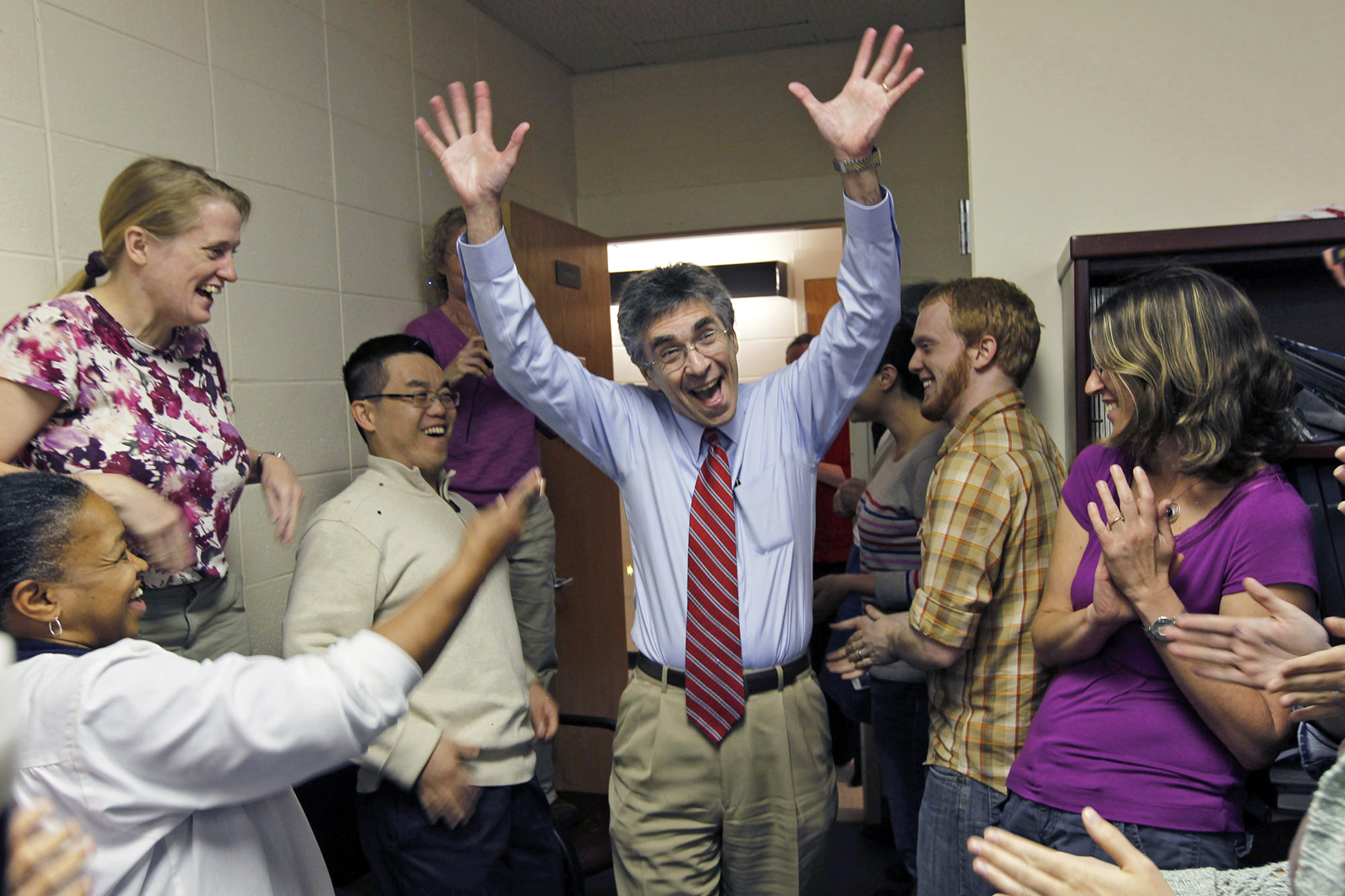 October 10, 2012: Dr. Robert Lefkowitz and his colleagues celebrate the announcement of his 2012 Nobel Prize in Chemistry. (Getty Images/Raleigh News &amp; Observer)