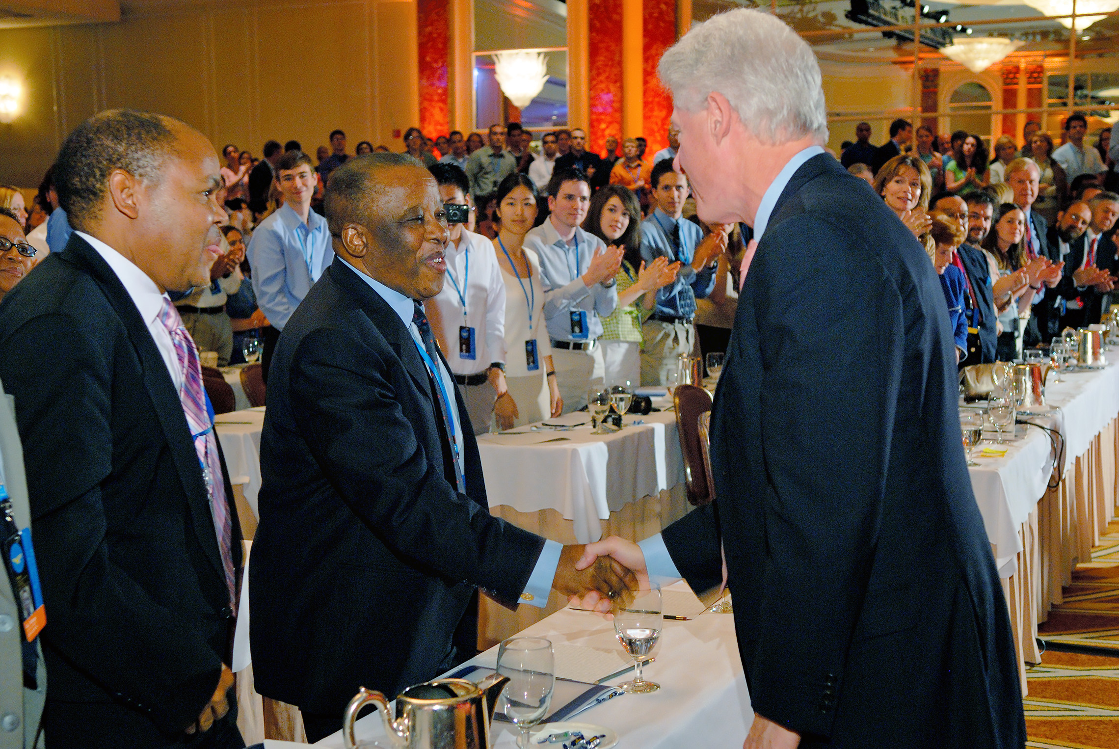 Golden Plate Award's Council member President Festus G. Mogae of Botswana greets President William J. Clinton.