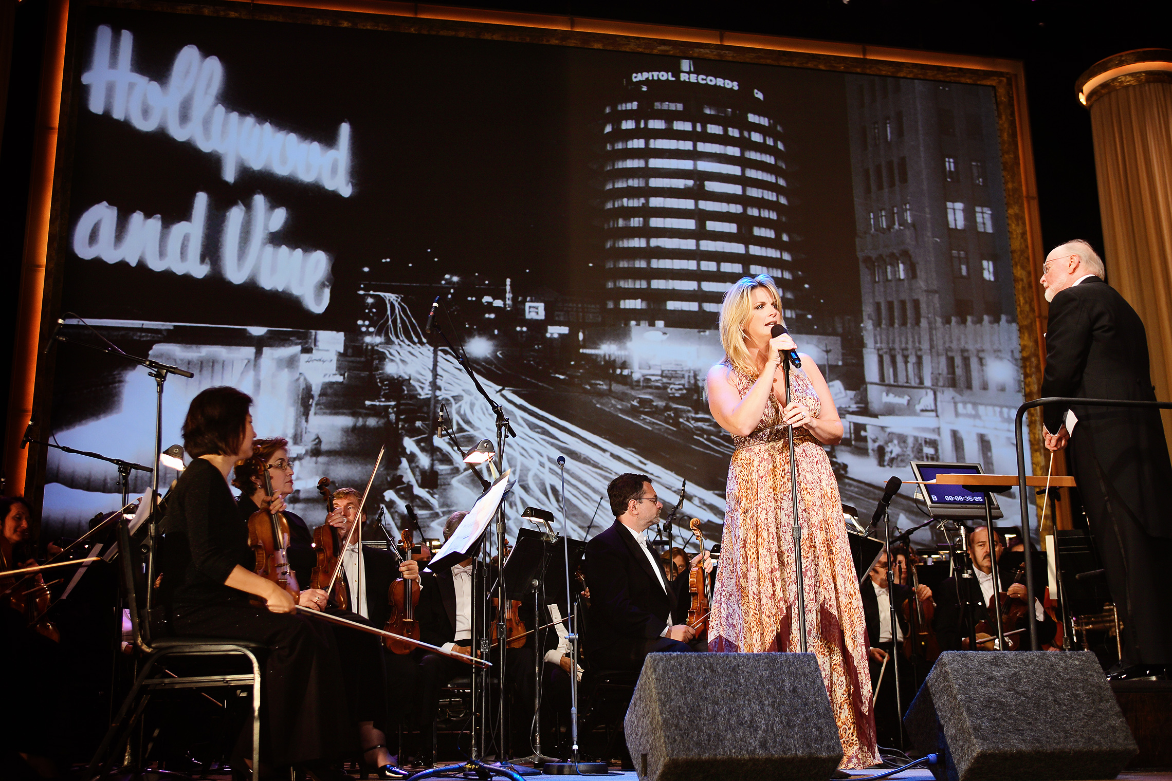 Academy member Trisha Yearwood performs with legendary conductor and composer John Williams at dinner.