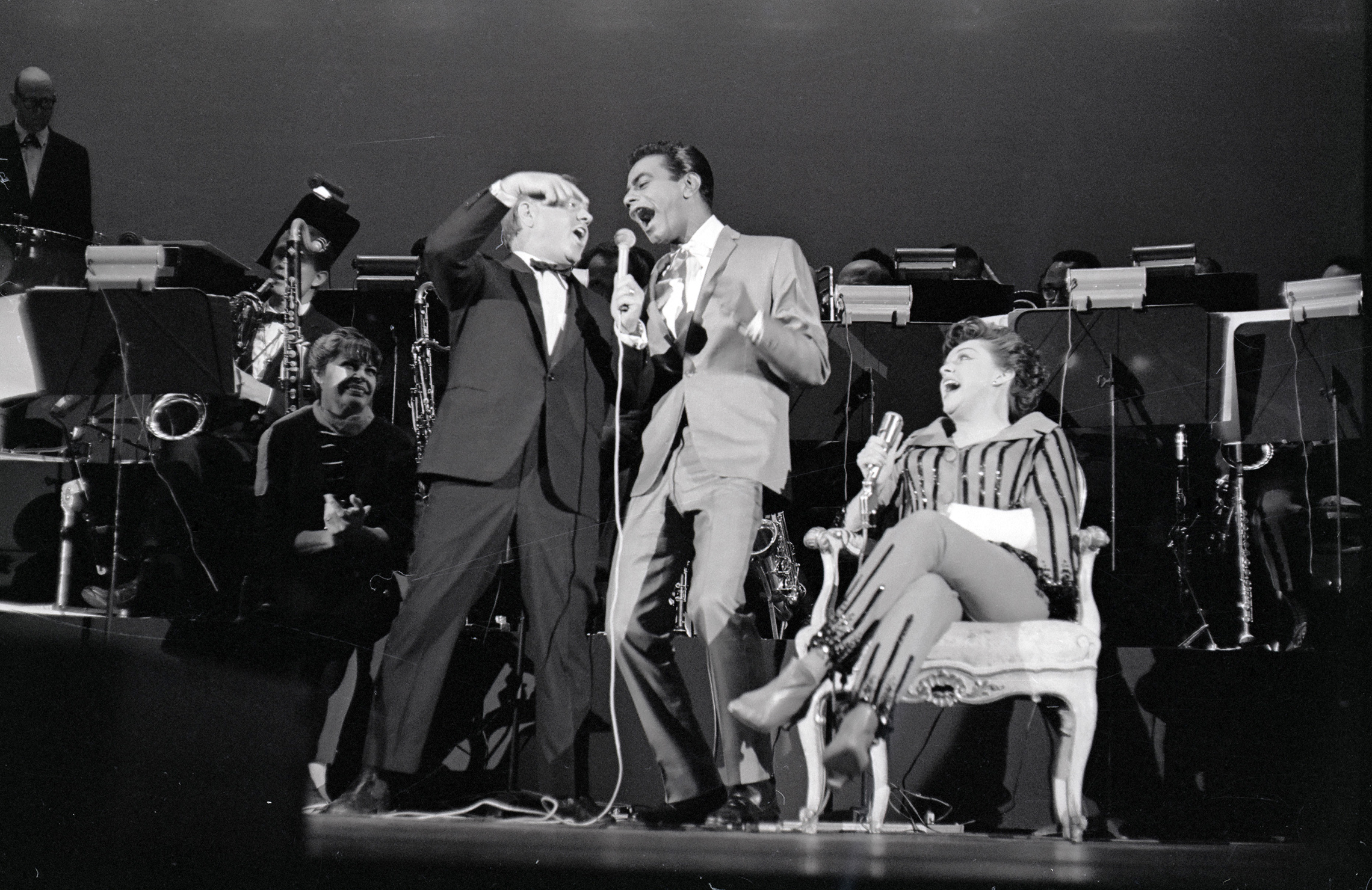 Mickey Rooney and Johnny Mathis onstage with Judy Garland in Hollywood, 1965. After Garland broke her arm on the day of a performance, Rooney and Mathis offered to appear with her and help her get through the show. (Copyright Bettmann/Corbis / AP Images)