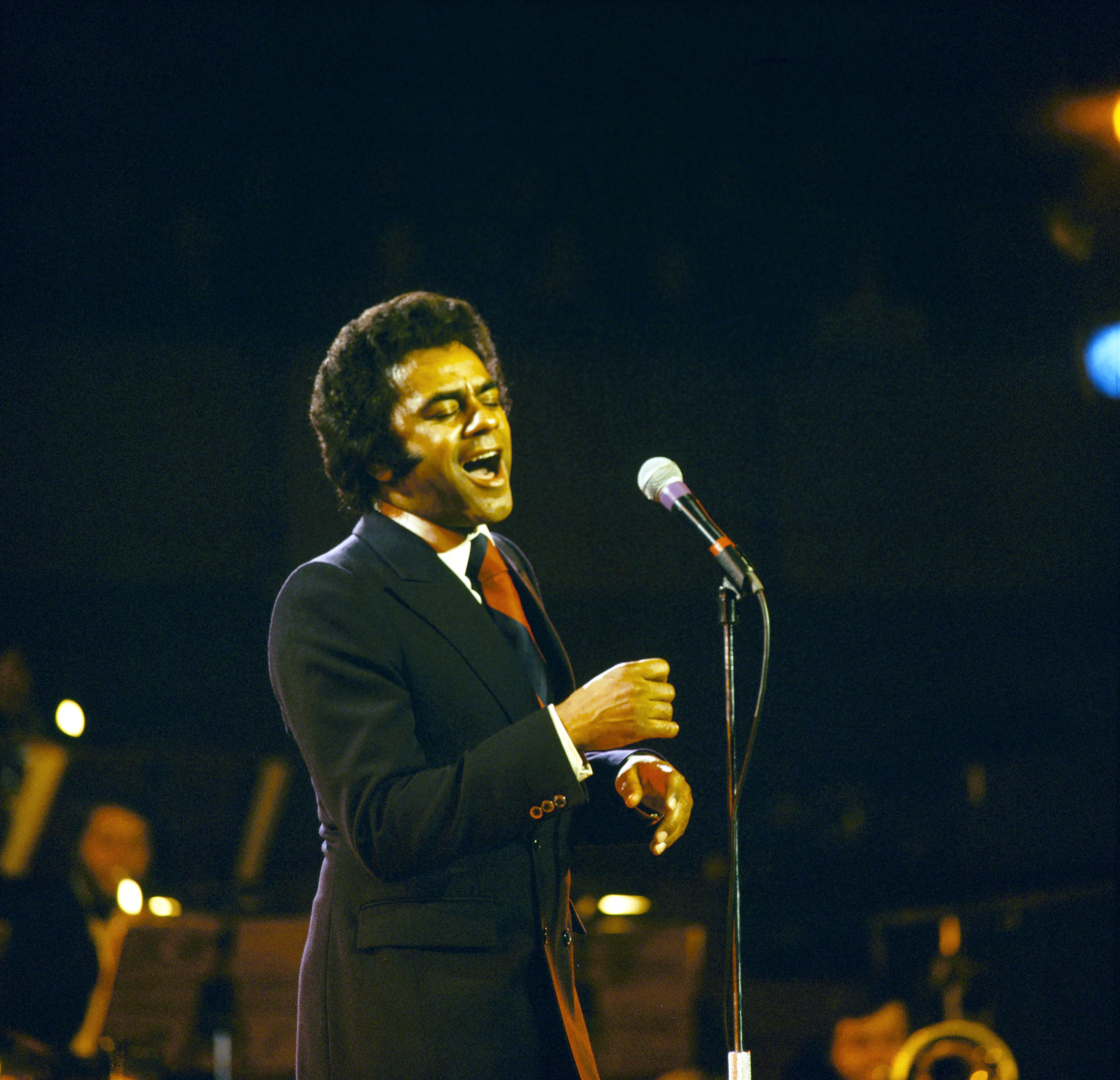 Johnny Mathis on stage in London, England in the early 1980's. (Photo by David Redfern/Redferns)