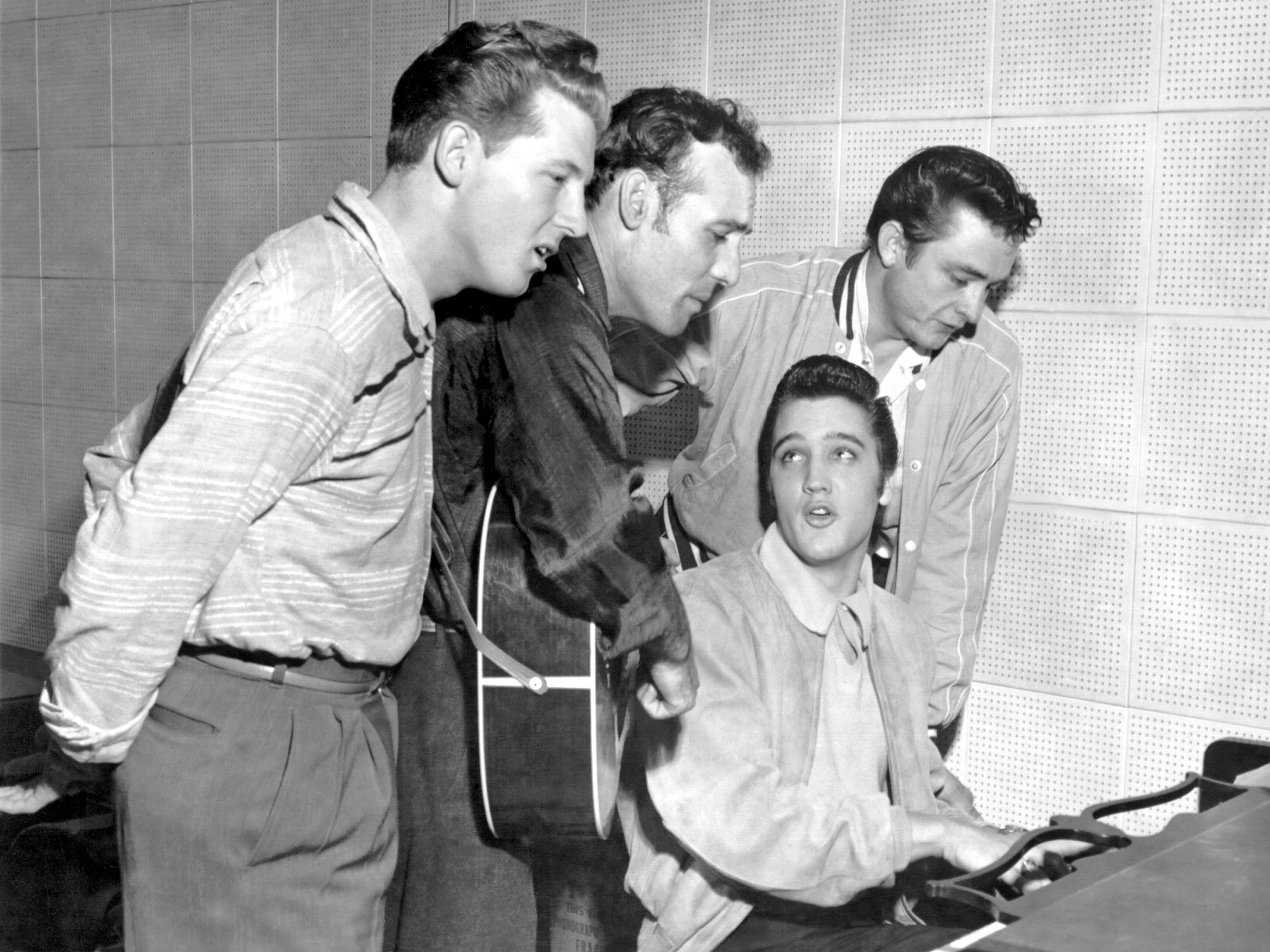 Music icons Jerry Lee Lewis, Carl Perkins, Elvis Presley and Johnny Cash, Sun Records' "Million Dollar Quartet," in an impromptu jam session, 1956. (© Michael Ochs Archives/Corbis)