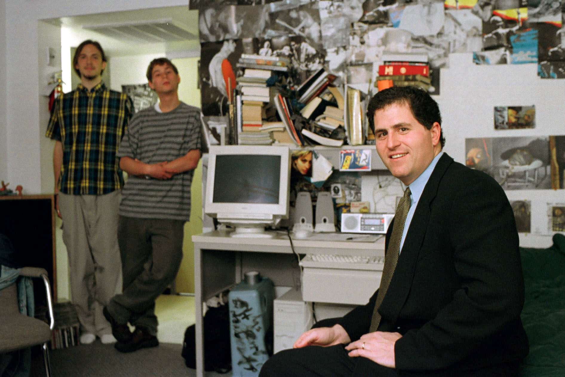 As the room's new occupants stand by, Michael Dell revisits the University of Texas dorm room where he started his company in 1984. (AP Images/Harry Cabluck)