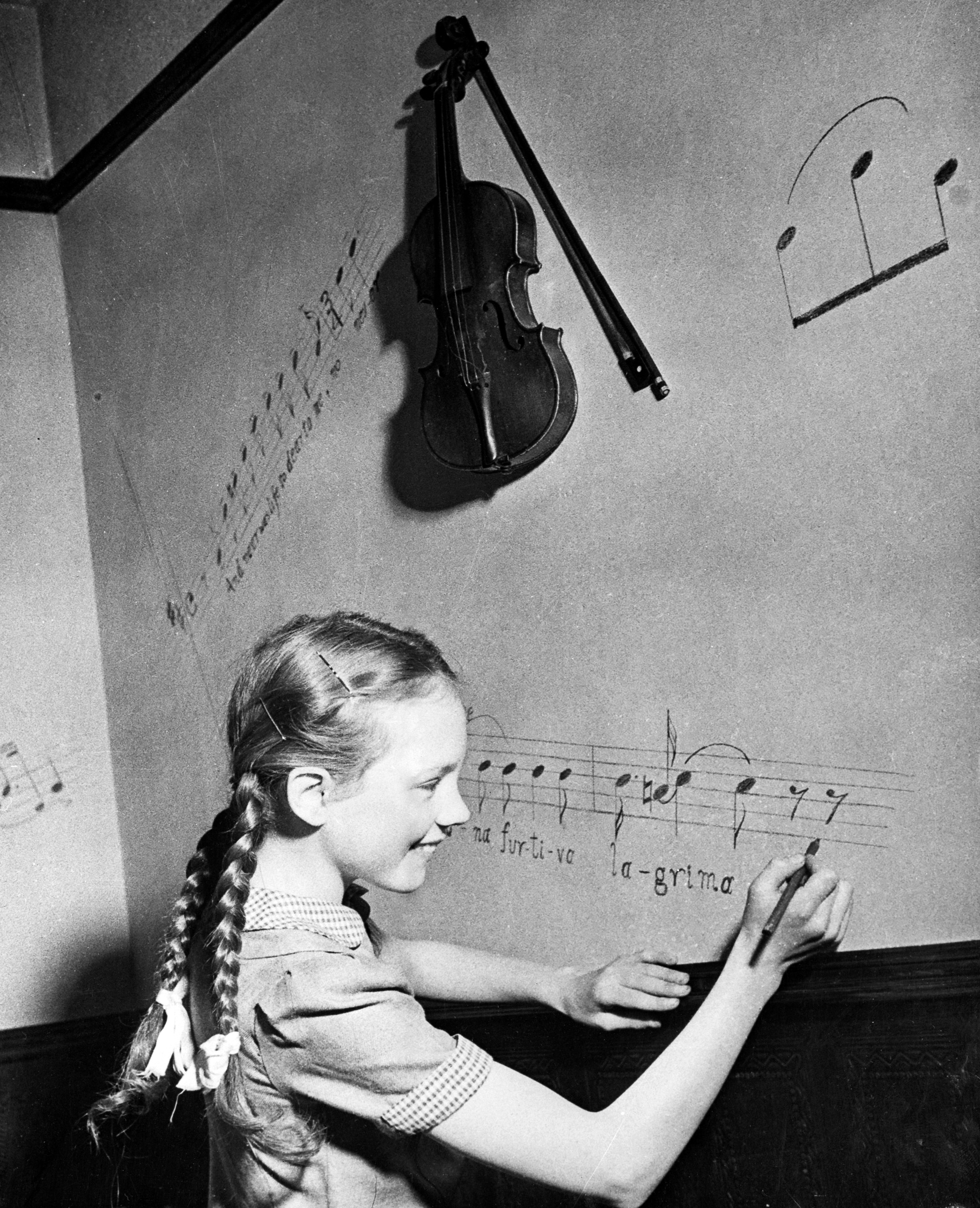 12-year-old Julie Andrews at play in the family music room in this 1947 publicity photo. (© Bettmann/CORBIS)