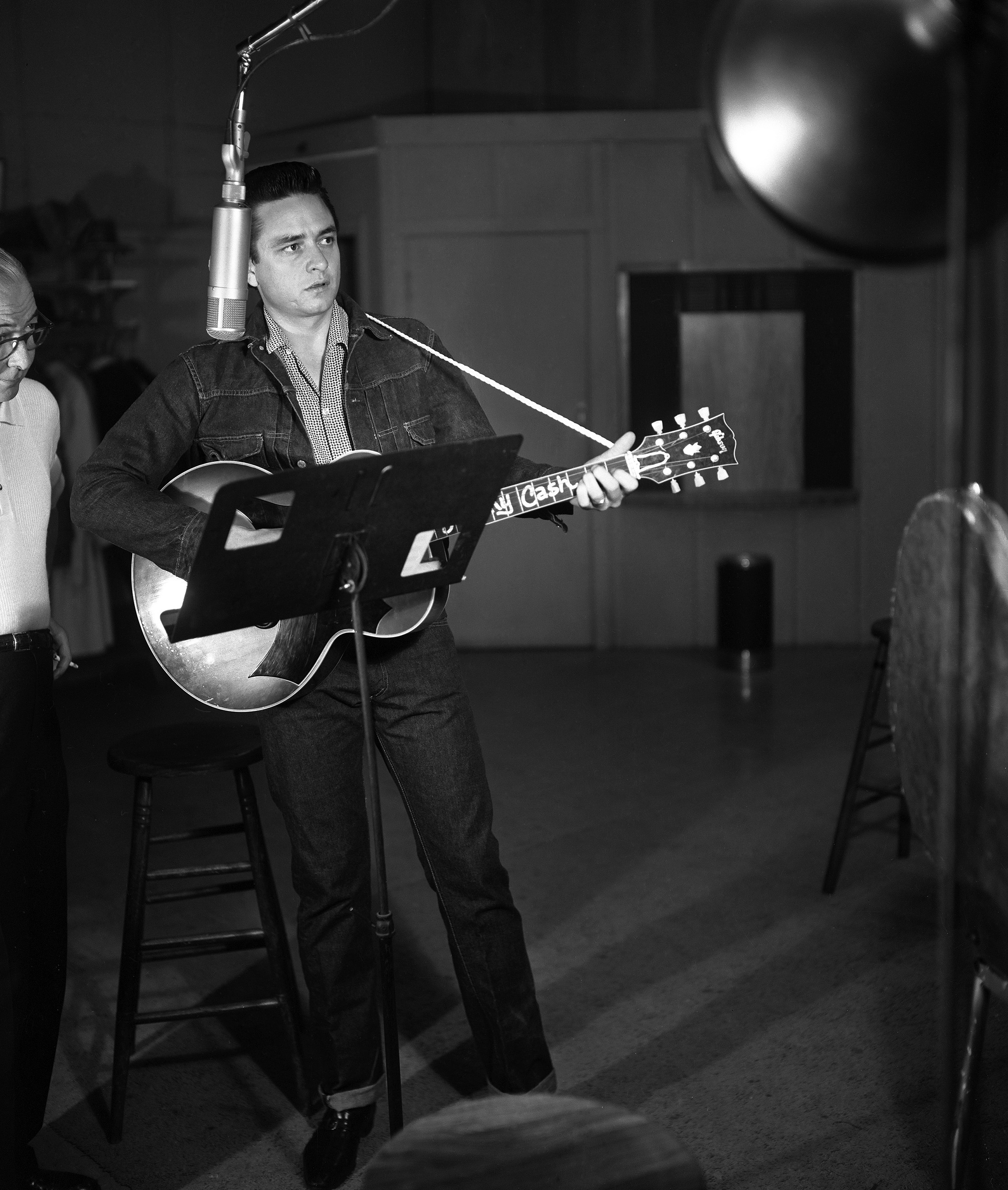 1958: Johnny Cash recording with Columbia Records producer Don Law at Bradley Studio which was bought by Columbia Records in 1962. (Photo by Elmer Williams/Country Music Hall of Fame and Museum/Getty Images)
